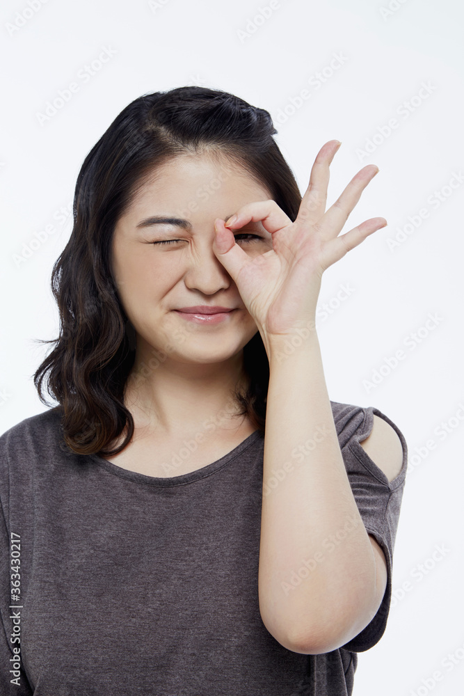Cheerful woman showing hand gesture Cheerful woman showing hand gesture