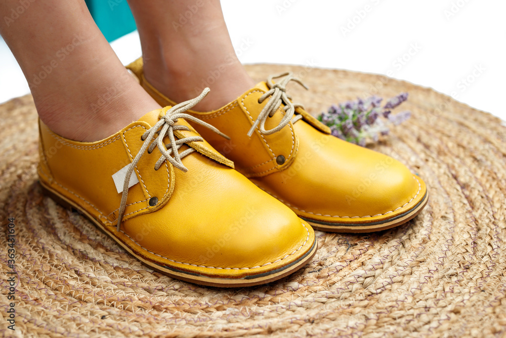 Ladies yellow mustard leather shoes isolated close-up Ladies yellow mustard leather shoes isolated close-up