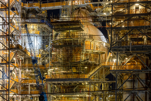 Distillation tower at an oil refinery at night