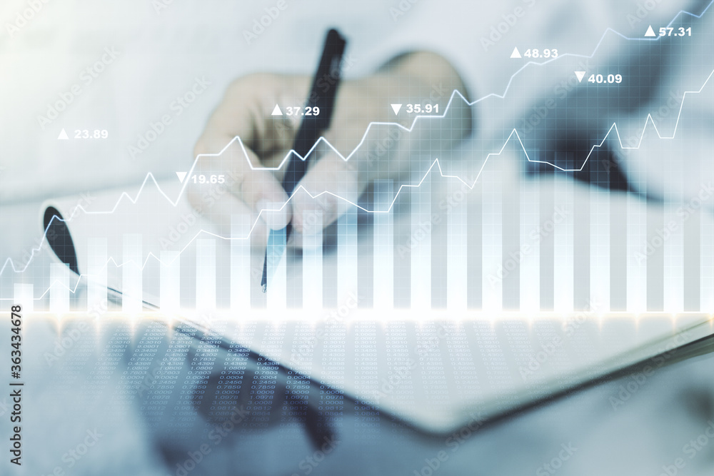 Abstract creative financial graph with hand writing in notebook on background, forex and investment concept. Multiexposure Abstract creative financial graph with hand writing in notebook on background, forex and investment concept. Multiexposure