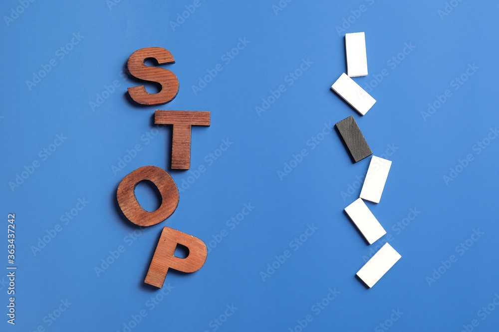 Text STOP with different blocks on color background. Stop racism Text STOP with different blocks on color background. Stop racism