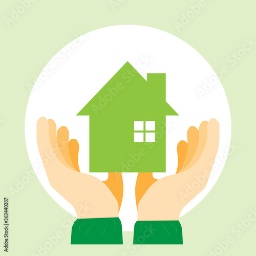 Hands protecting Warm and cozy a small model of a house