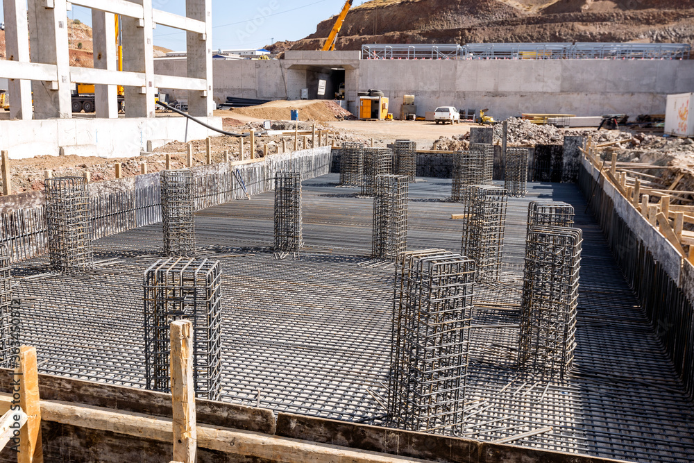 Foto de View of the rebar beam cages on the foundation for concrete and