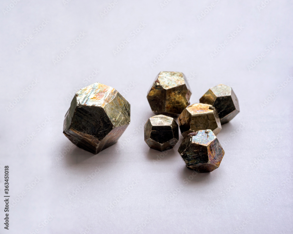 The pyrite group of minerals is a set of cubic crystal system minerals with diploidal structure. The mineral pyrite, or iron pyrite, also known as fool's gold, is an iron sulfide. The pyrite group of minerals is a set of cubic crystal system minerals with diploidal structure. The mineral pyrite, or iron pyrite, also known as fool's gold, is an iron sulfide.