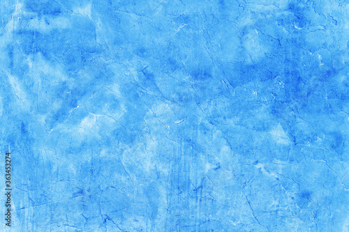 Creative beautiful bright blue background, cracks and scratches on the concrete. Grungy concrete surface. Great background or texture for your project.