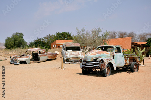 Abandoned vintage car wrecks at Solitaire Town in Sossusvlei in the Namib Desert, Namibia, Africa