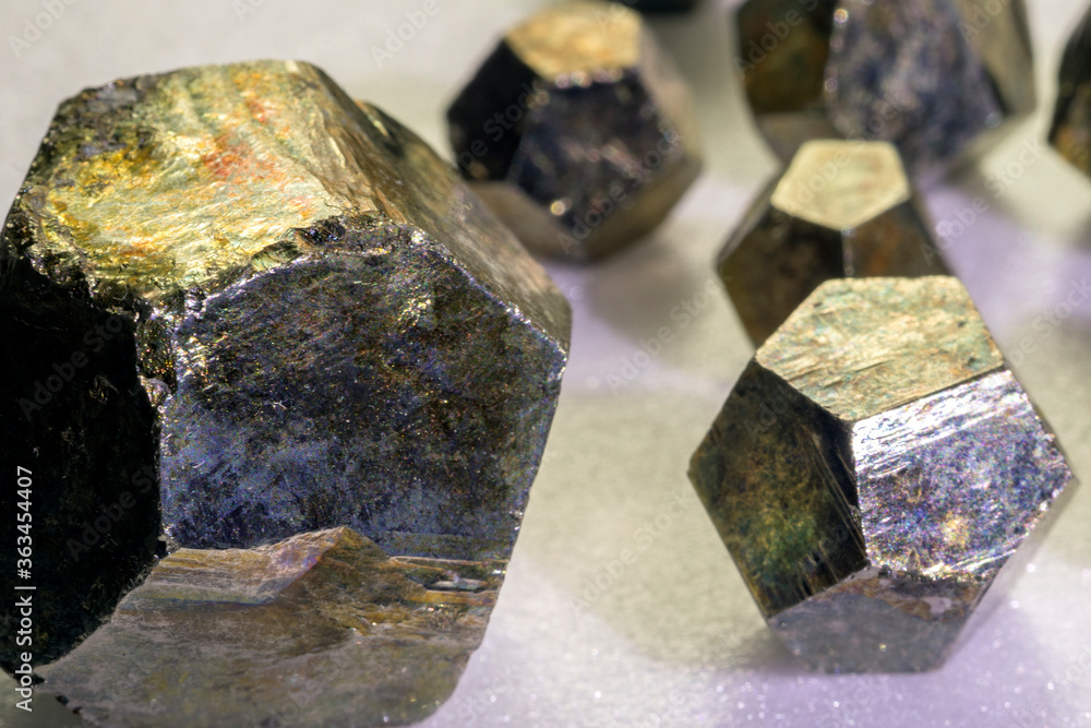 View of the group pyrites. Pyrite is considered the most common of the sulfide minerals. Pyrite's metallic luster and pale brass-yellow hue give it a superficial resemblance to gold. View of the group pyrites. Pyrite is considered the most common of the sulfide minerals. Pyrite's metallic luster and pale brass-yellow hue give it a superficial resemblance to gold.