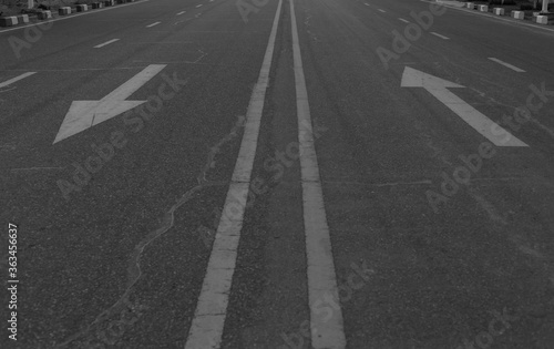 Road marking arrow on asphalt