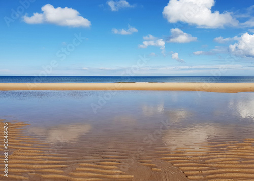 Beautiful, blue sunny beach reflections