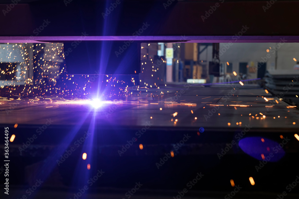 View of the cnc plasma cutting machine. Plasma cutting torches usually use a copper nozzle to constrict the gas stream with the arc flowing through it.