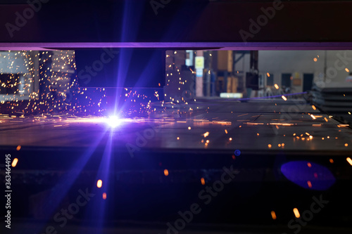 View of the cnc plasma cutting machine. Plasma cutting torches usually use a copper nozzle to constrict the gas stream with the arc flowing through it.
