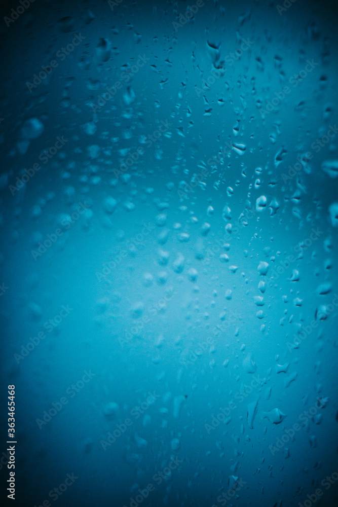 Raindrops on window glass,condensation on the window,natural background,color texture,blue abstract and pattern
Raindrops on window glass,condensation on the window,natural background,color texture,blue abstract and pattern