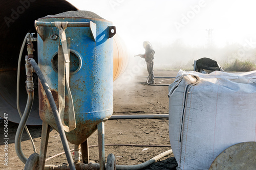 Sandblasting, abrasive or bead blasting. It is a generic term for the process of smoothing, shaping and cleaning a hard surface by forcing solid particles across that surface at high speeds. photo