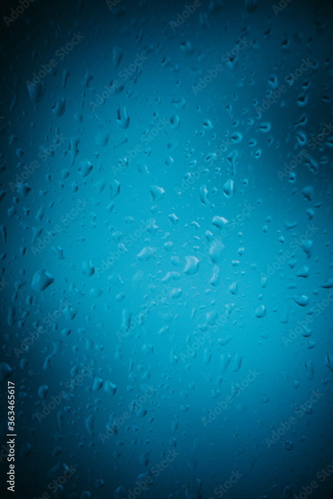 Raindrops on window glass,condensation on the window,natural background,color texture,blue abstract and pattern
Raindrops on window glass,condensation on the window,natural background,color texture,blue abstract and pattern