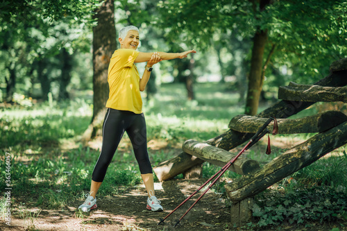 Senior Woman Stretching After a Walking Exercise © Microgen