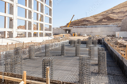 Fotografie Installation of rebar, reinforcing steel bars for concrete in the construction site