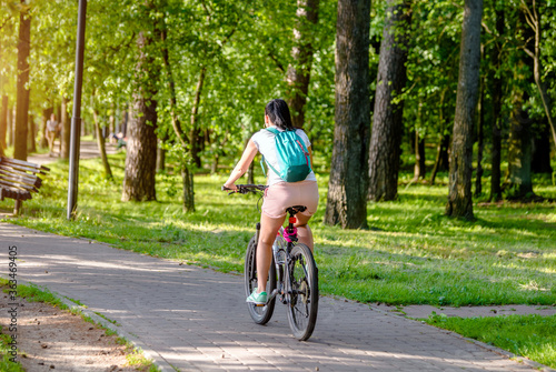 Wallpaper Mural Cyclist ride on the bike path in the city Park
 Torontodigital.ca