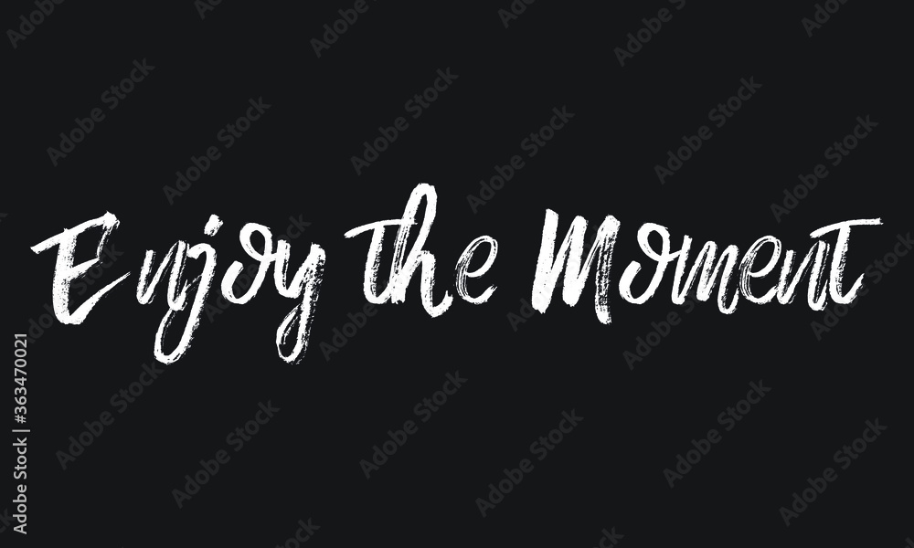 Fototapeta premium Enjoy the Moment Chalk white text lettering typography and Calligraphy phrase isolated on the Black background 