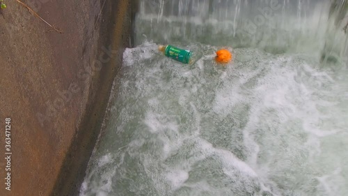 Wallpaper Mural PET bottle and orange floating and drowning in a waterfall Torontodigital.ca