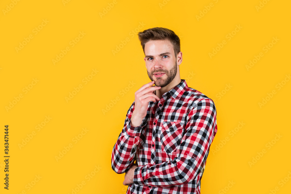 Fototapeta premium Autumn style. confident and calm. handsome casual man standing with beard and bristle. cheerful and stylish. handsome man on red background. indoor portrait of sexy european businessman. copy space
