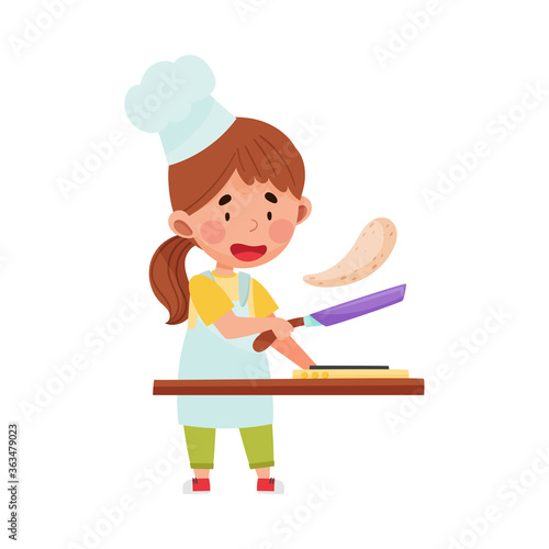Little Girl Character in Hat and Apron Frying Pancakes Vector Illustration