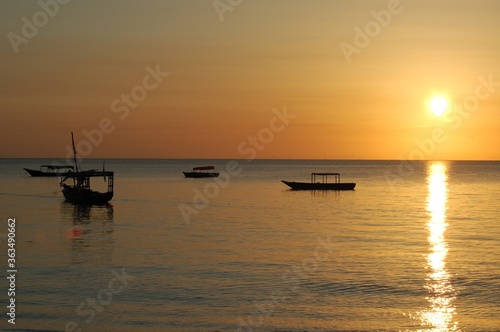 Boats on the sunset horizon of Zanzibar, Tanzania  © Spirit of a Jewel
