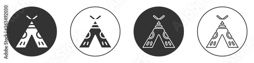 Black Traditional indian teepee or wigwam icon isolated on white background. Indian tent. Circle button. Vector Illustration.