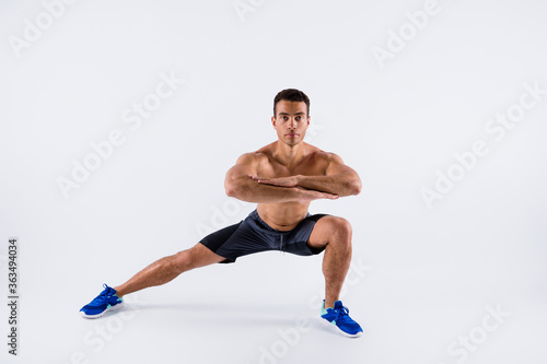 Full length body size view of his he nice attractive sportive professional focused guy doing sit-up exercise daily plan isolated over light white pastel color background