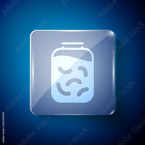 White Pickled cucumbers in a jar icon isolated on blue background. Square glass panels. Vector Illustration.