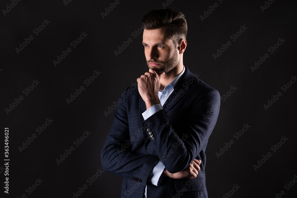 Portrait of his he nice attractive content successful smart clever thoughtful guy employer banker financier director thinking planning finance strategy isolated on dark black color background