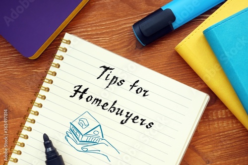 Business concept about Tips For Homebuyers with sign on the sheet. photo