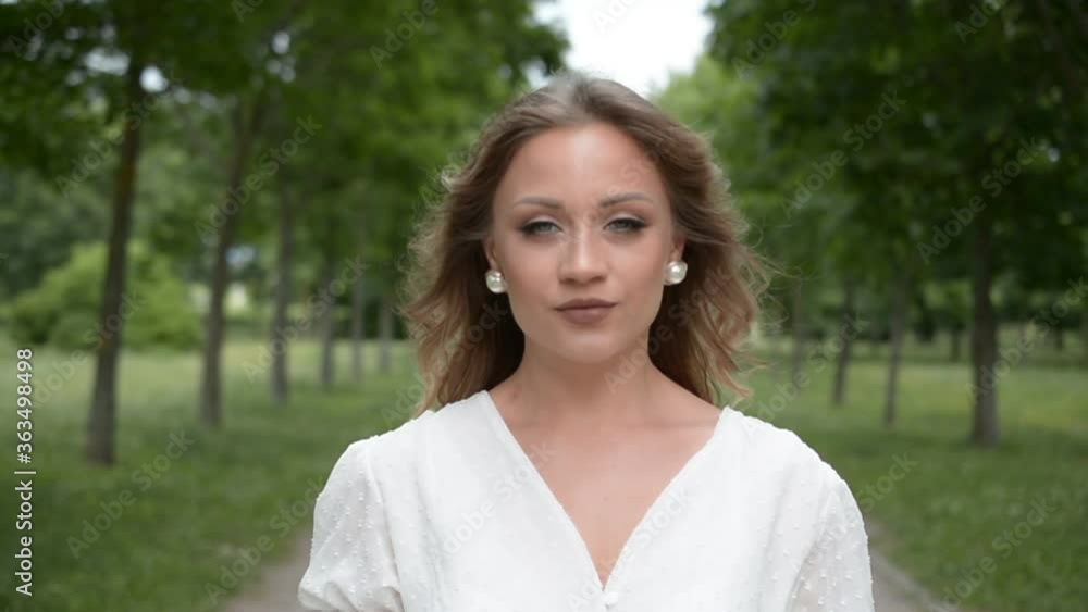 Beautiful young stylish russian woman hipster portrait in summer park hd stock footage Beautiful young stylish russian woman hipster portrait in summer park hd stock footage