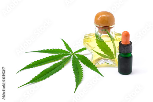 Cannabis essential oil, CBD oil extract with canabis green leaf isolated on white background. Medical marijuana , herbal medicine plant and health care concept. Space for text.