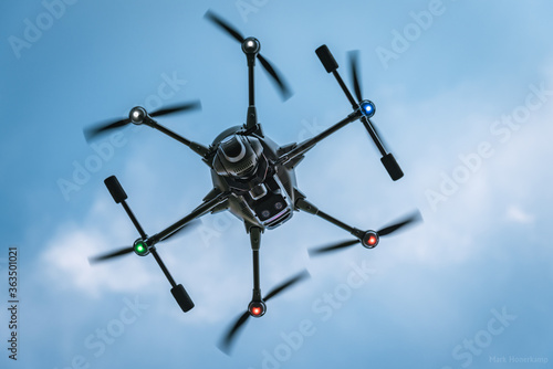 a drone in front of cloudy sky
