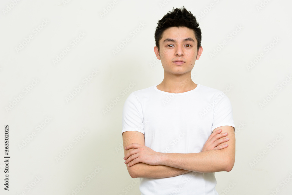 Portrait of young handsome Asian man with arms crossed Portrait of young handsome Asian man with arms crossed