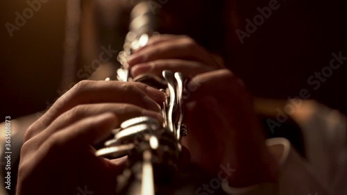 fingers player on Clarinet, in a dark room.  close up, 
Low camera angle
Hasidic Jewish player photo