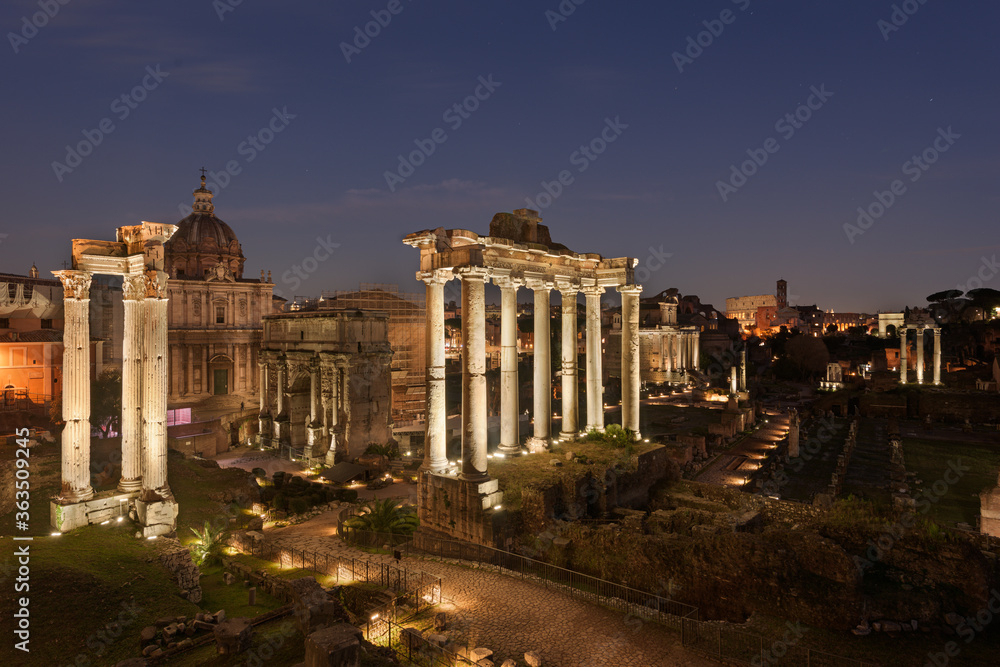 Ruins of the Roman Forum at night in Rome, Italy