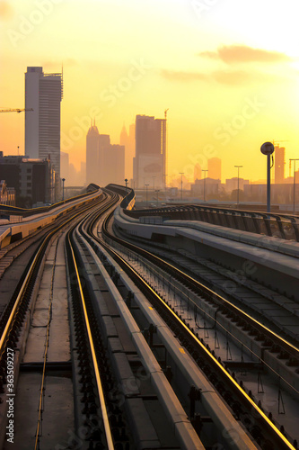 curved metro track at beautiful sunset in Dubai , city of future
