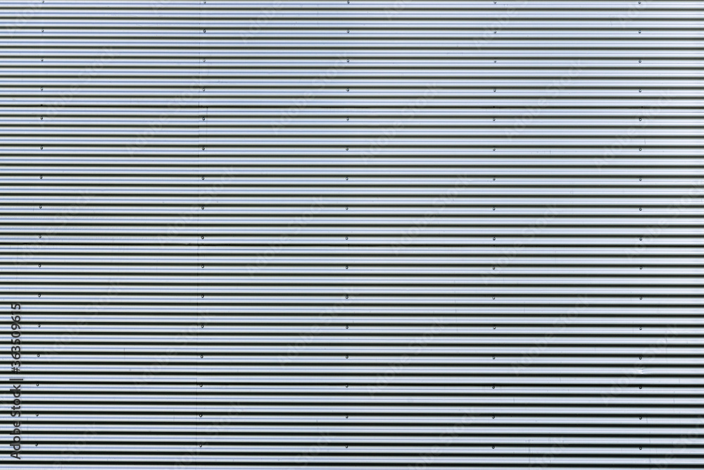 Corrugated metal sheet. New and Modern silver grey background pattern. Corrugated metal sheet. New and Modern silver grey background pattern.