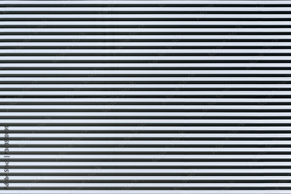Fototapeta premium Corrugated metal sheet. New and Modern silver grey background pattern.
