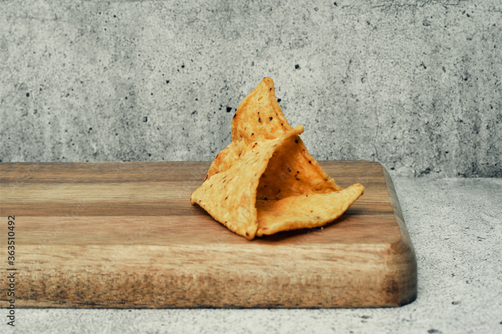 Corn cheese, snacks with sauce on a wooden stand. Beer snack, dish on the menu. Close up. Corn cheese, snacks with sauce on a wooden stand. Beer snack, dish on the menu. Close up.