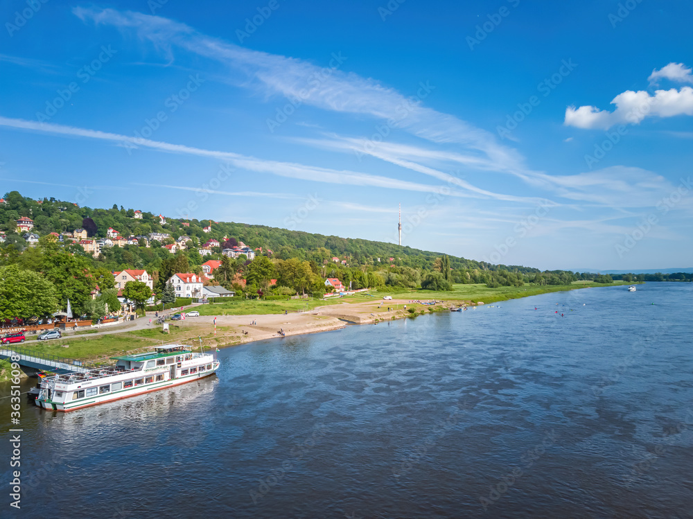 Elbe River, Dresden, Saxony, Germany - View of the Loschwitz Elbe riverside with excursion steamer and television tower, Dresden, Saxony, Germany.