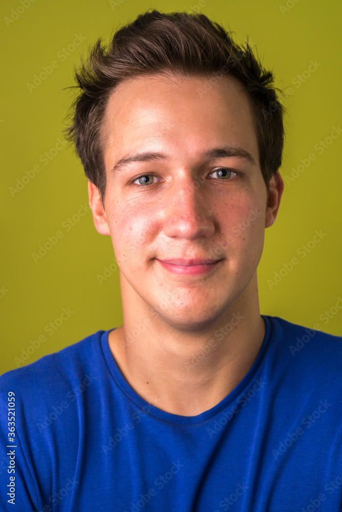 Fototapeta premium Face of young handsome man looking at camera