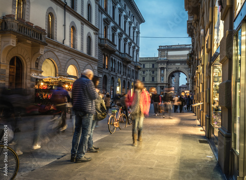People in Florence shopping streets at night