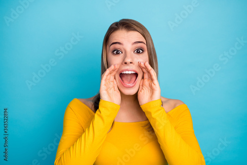 Close-up portrait of her she nice-looking attractive lovely charming pretty cheerful cheery glad girl shouting news isolated over bright vivid shine vibrant blue color background