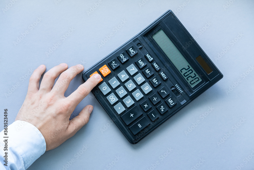 Reset the calculator by pressing the button with your index finger ...