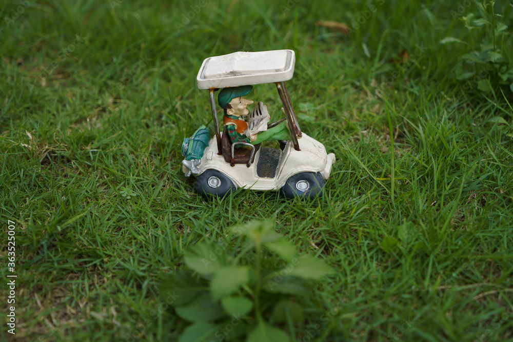 Fototapeta premium golf cart on the green grass