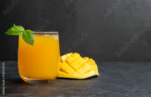 Fresh fruit juice in the jar. on dark background.