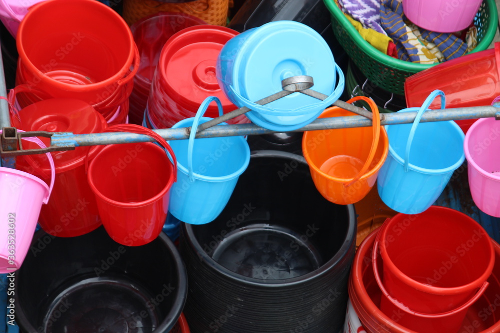 Colorful plastic made bowl and buckets selling on local market. Colorful plastic made bowl and buckets selling on local market.