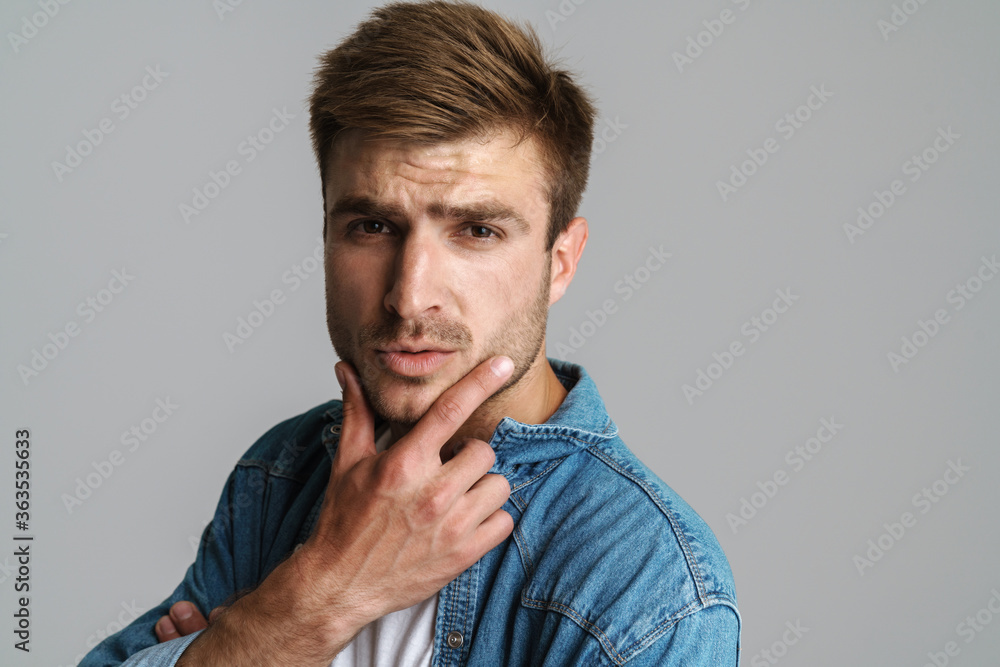 Portrait of confident redhead man posing and looking at camera Portrait of confident redhead man posing and looking at camera